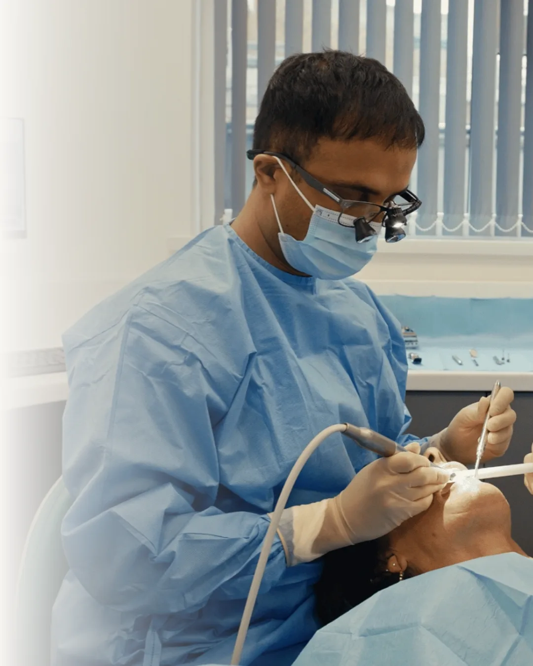 Dr Mohsin Patel providing dental implant treatment at Infinity Dental Clinic